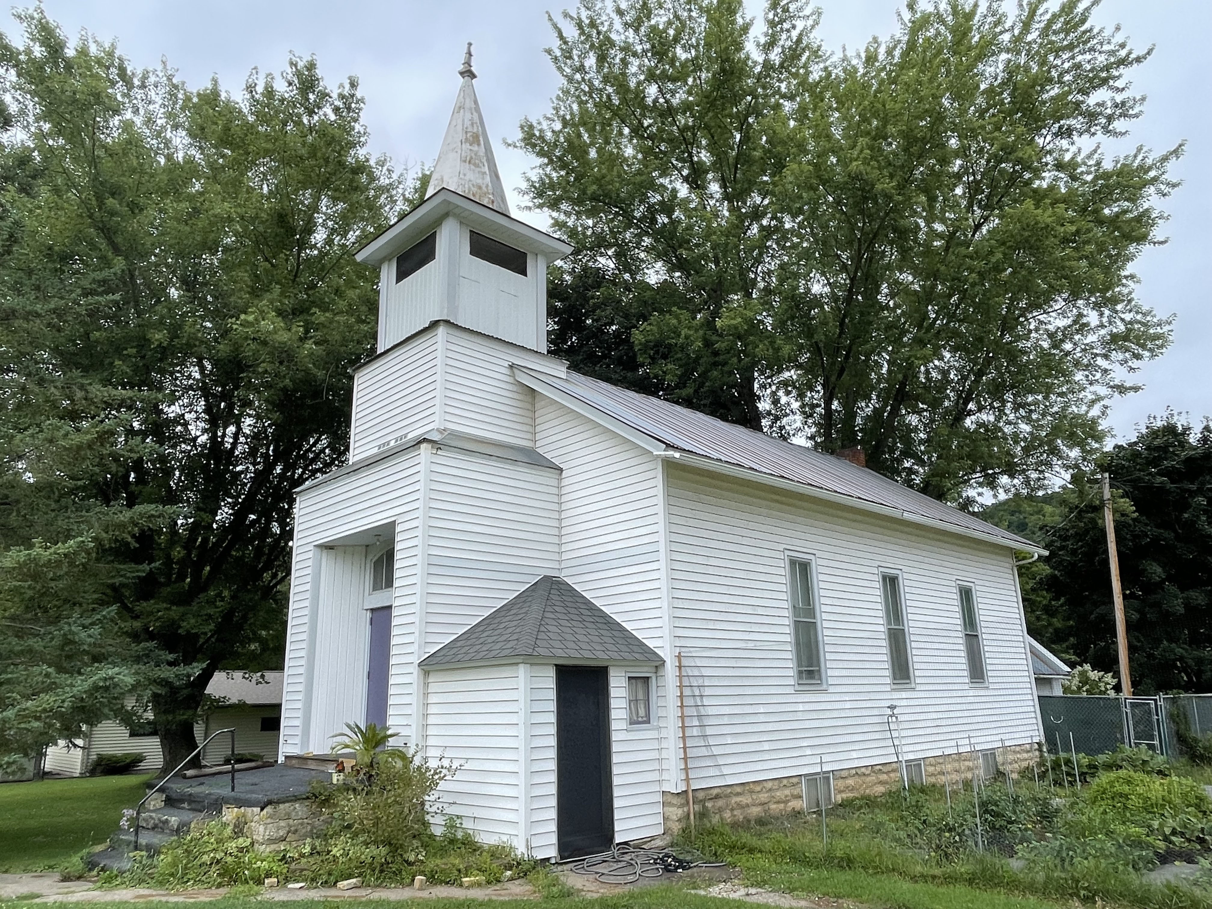 picture of old white church studio building